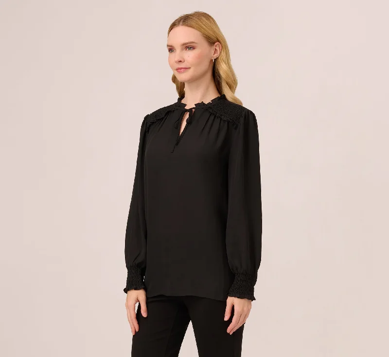 ruffle-tie-neck-top-with-smocked-long-sleeves-in-black-ad1s301826