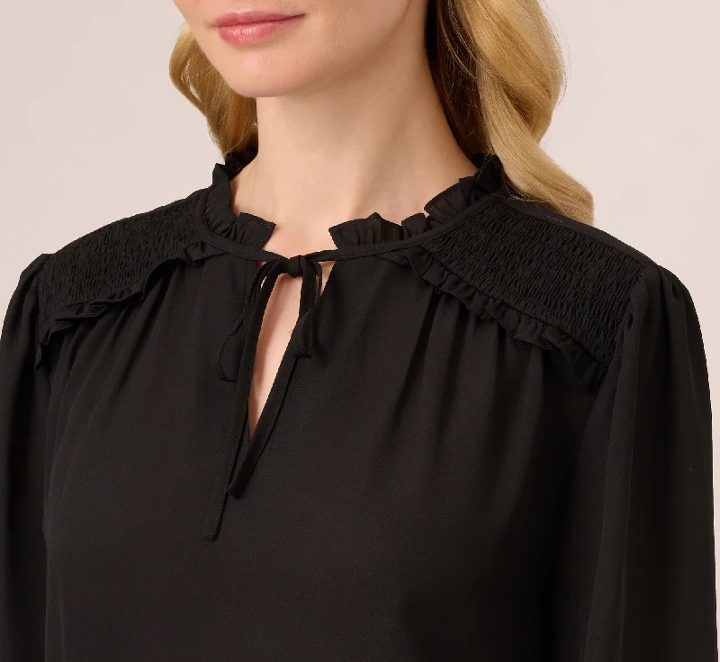 ruffle-tie-neck-top-with-smocked-long-sleeves-in-black-ad1s301826